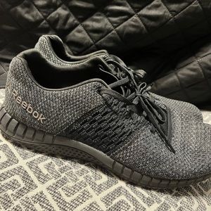 Dark gray reebok athletic shoes